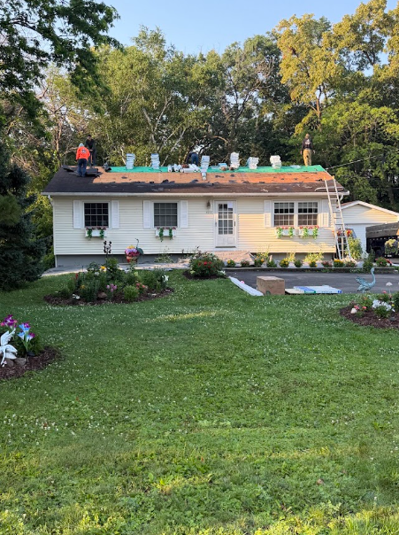 Rocket Roofing crew tearing off and re-decking the roof of a Minnesota rambler