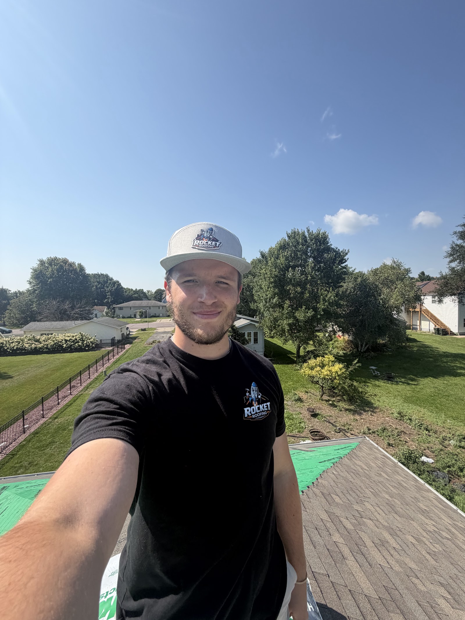 Owen on a rooftop on a sunny day in a west metro neighborhood