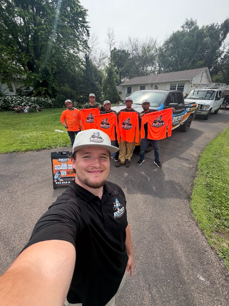 The Rocket Roofing crew together in the driveway before starting a roof replacement